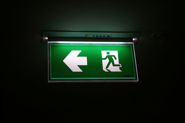 The safety green sign symbol for go to the fire exit.