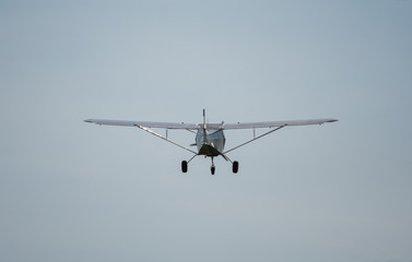 Aeroplane from below flying high in sunny blue sky,Romania,Bistrita