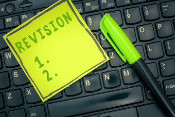 Handwriting text Revision. Concept meaning revised edition or form something action of revising...
