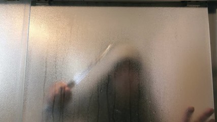 Man sneaking with knife in the bathroom in 4K
