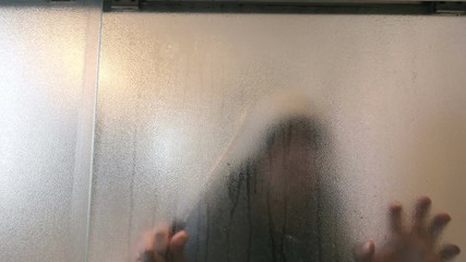 Man sneaking with knife in the bathroom in 4K