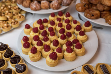 White plate canapés at the buffet table