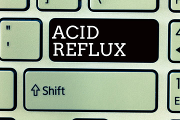 Text sign showing Acid Reflux. Conceptual photo Condition where acid backs up from the stomach to...