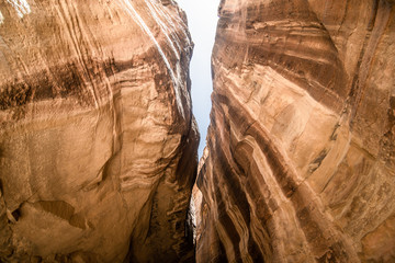 The Siq, the narrow slot-canyon that serves as the entrance passage to the hidden city of Petra, Jordan. This is an UNESCO World Heritage Site