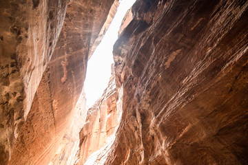 The Siq, the narrow slot-canyon that serves as the entrance passage to the hidden city of Petra, Jordan. This is an UNESCO World Heritage Site