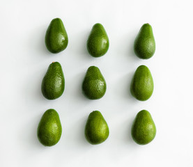 Fresh ripe avocados on white background