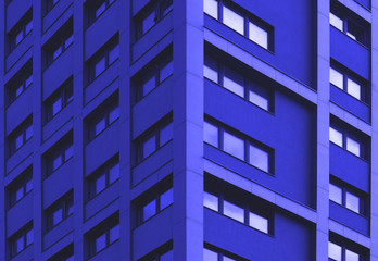 Obraz premium Texture, building facade, architectural background, urban backdrop, wall with glass windows 