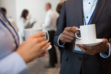 business, communication and education concept - international group of people with conference...