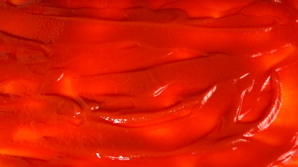 Red sauce splashes as background.