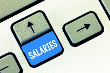Writing note showing Salaries. Business photo showcasing fixed regular payment typically paid on...