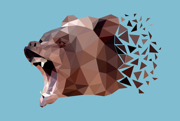 The head of bear that growls and shows fangs is made in the polygonal style. Vector, EPS 10