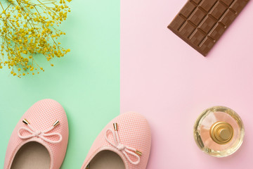 Pair of women's girl's ballerina pink pumps flats perfume flowers, chocolate tablet on duo tone...