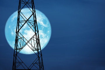 full harvest moon on sky and silhouette power electric pole