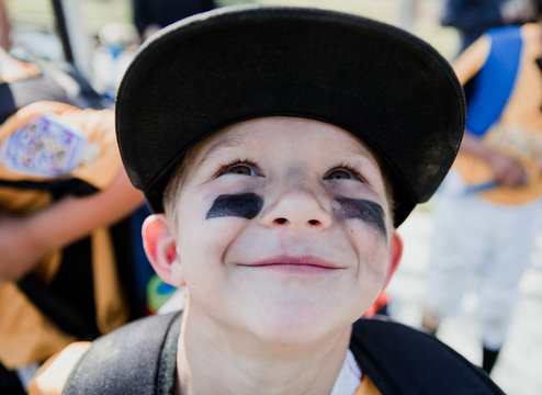 Portrait of a boy with eye black, California, United States