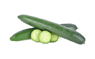 whole and sliced fresh Japanese cucumbers on white background