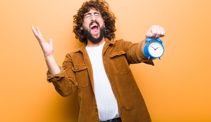 young man with crazy hair in motion and an alarm clock