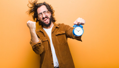 young man with crazy hair in motion and an alarm clock