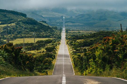 Endless road into the cloudy mountains & hills of Pico Island, Azores, Portugal