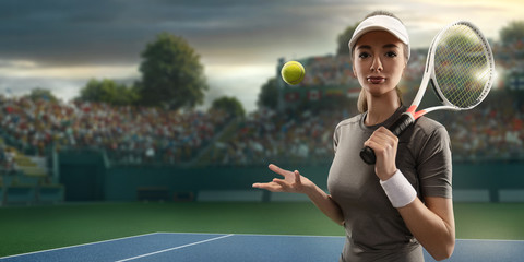 Female tennis player with racket and ball on a professional court