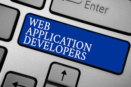 Word writing text Web Application Developers. Business concept for Internet programming experts Technology software Grey silvery keyboard with bold blue color button 3 white color texts