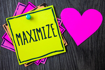 Handwriting text writing Maximize. Concept meaning Increase to the greatest possible amount or degree Make larger Border sticky remember cards love heart pinned dark woody background