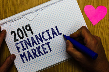 Handwriting text 2019 Financial Market. Concept meaning place where trading of equities, bonds, currencies Paper register multiline text pen handwriting love heart table background