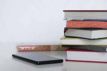 Open book on wood desk in the library room with blurred focus for background, education back to school concept, vintage color tone process