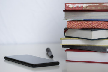 Open book on wood desk in the library room with blurred focus for background, education back to school concept, vintage color tone process