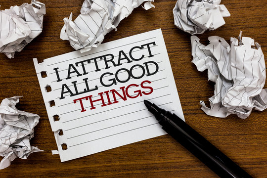 Text sign showing I Attract All Good Things. Conceptual photo Positive attraction law Motivation Affirmation Paper lumps laid randomly around white notepad touch black pen on woody floor