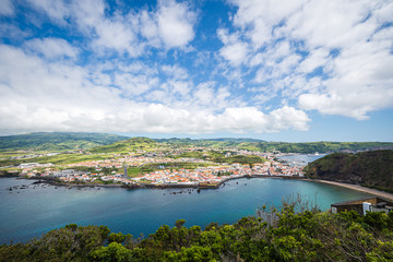 Panorama of the port of Horta and beach of Porto Pim with turquoise water and blue summer sky, Faial Island, Azores Islands, Portugal