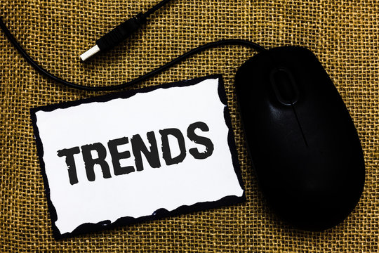 Handwriting text Trends. Concept meaning General projected directions of something according to time USB black mouse art board paper ideas thoughts ideas designs mat shadow