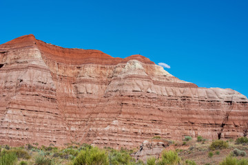Low angle landscape of striped hillside at the Toadstools trail in Grand Staircase Escalante National Monument