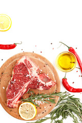 Raw t-bone steak on a wooden board with rosemary and spices on a white background. Top view.
