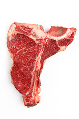 Raw t-bone steak on a white background.