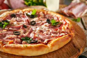 Pizza Restaurant Menu - Delicious Fresh Meat Pizza with Bacon, Sausage and Chicken. Pizza on Rustic Wooden Table with Ingredients