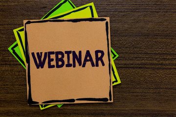 Word writing text Webinar. Business concept for defined as seminar conducted over the Internet Web conferencing Paper notes Important reminders Express ideas messages Wooden background