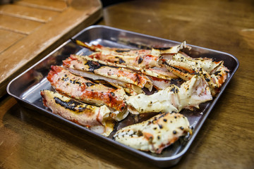 BBQ Legs of fresh Japanese hair crab in a gray tray, King Crab of Hokkaido, Japan , Fresh Red King Crab.