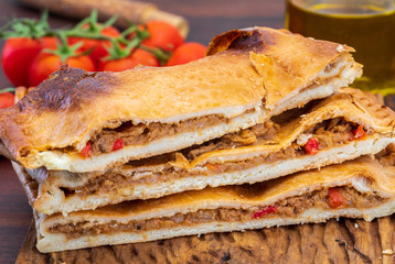 Tuna pie. Typical Galician dish (Galicia) and Spain. With natural ingredients such as tomato, onion, pepper, eggplant, tuna, boiled egg, wheat and vegetable oil. Fish and vegetables cake.