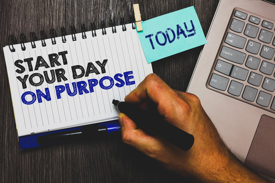 Word writing text Start Your Day On Purpose. Business concept for Have clean ideas of what you are going to do Paperclip grip sticky note with text hand hold pen computer on wooden desk - Powered by Adobe