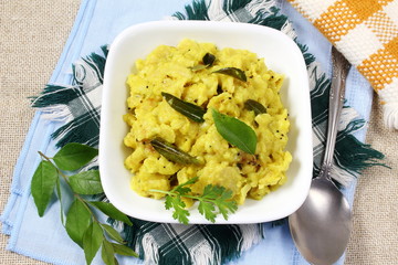 indian gujarati traditional food stir fry/vaghareli/tadka/chaunk roti bhakhri make with yogurt gravy and spice curry