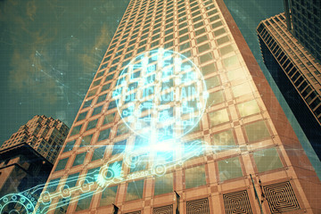 Multi exposure of cryptocurrency theme hologram drawing and city veiw background. Concept of...