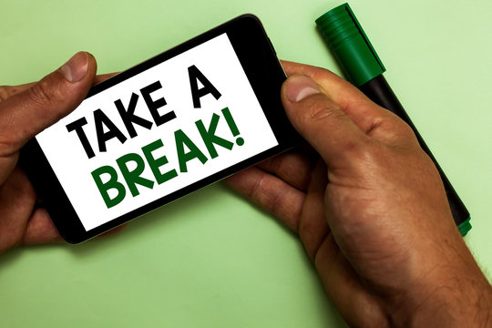Writing note showing Take A Break. Business photo showcasing Resting Stop doing something recreation time get out of work Human hand hold iPhone with texts touched green marker