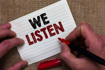 Writing note showing We Listen. Business photo showcasing Group of people that is willing to hear...