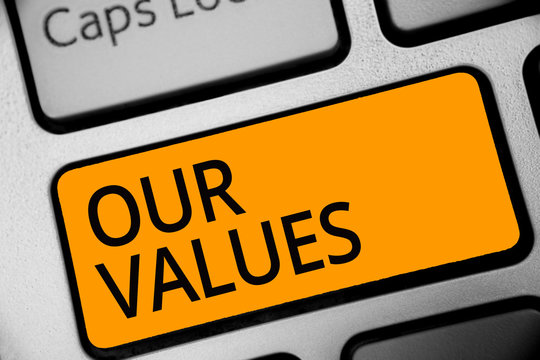 Conceptual hand writing showing Our Values. Business photo showcasing list of morals companies or individuals commit to do them Keyboard orange key computer computing reflection document
