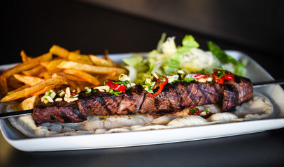 beef skewer with french fries & mix salad