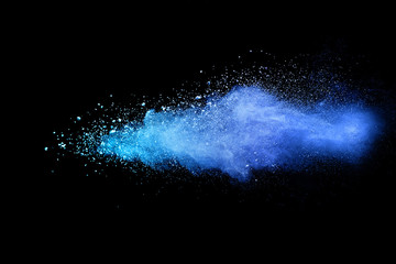 Blue powder explosion on black background. Colored cloud. Colorful dust explode. Paint Holi. - obrazy, fototapety, plakaty