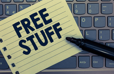 Conceptual hand writing showing Free Stuff. Business photo showcasing Any thing that you can have in a store that is not being paid Notebook paper keyboard Inspiration computer black marker