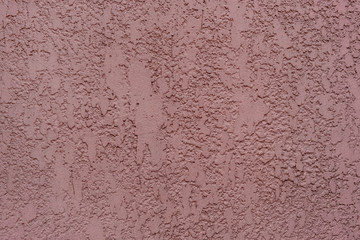 The texture of the old concrete wall. Pink cement background.