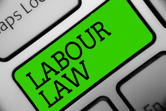 Text sign showing Labour Law. Conceptual photo Rules implemented by the state between employers and employee Keyboard green key Intention create computer computing reflection document