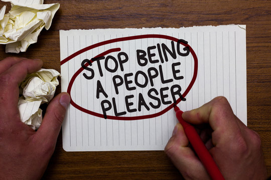 Text sign showing Stop Being A People Pleaser. Conceptual photo Do what you like not things other people want Hand hold paper lob and red pen red circled black words on white paper